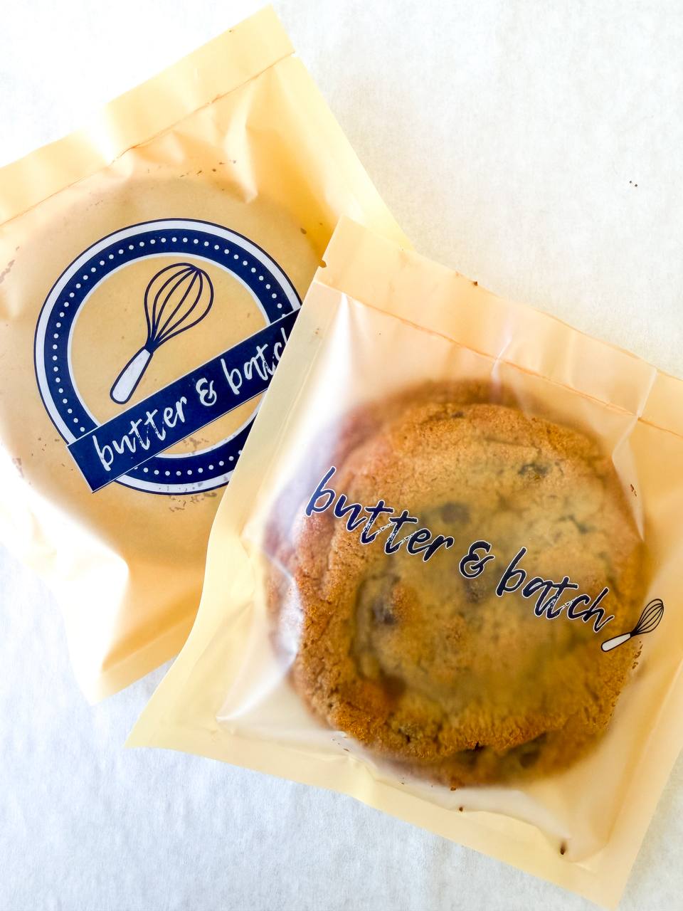 Butter & Batch branded cookie packaging with logo sticker